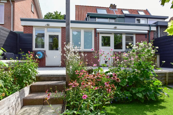 Eengezinswoning, 2-onder-1-kapwoning (dijkwoning) Ringdijk 11 in De Kwakel