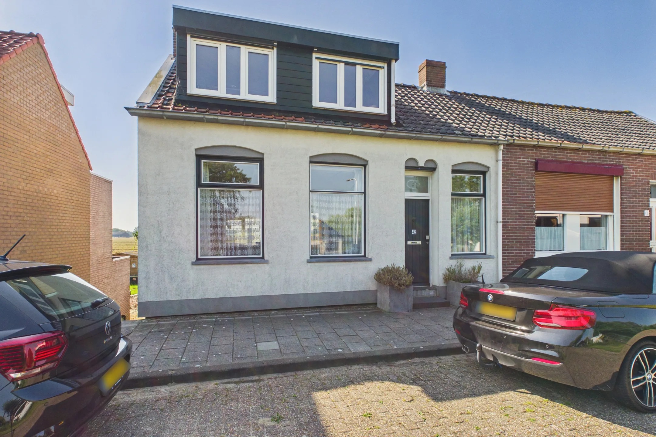2-onder-1-kapwoning (dijkwoning) Molendijk 42 in Hoek