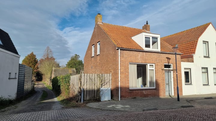 Hoekwoning (dijkwoning) Dorpsstraat 27 in Zuidzande