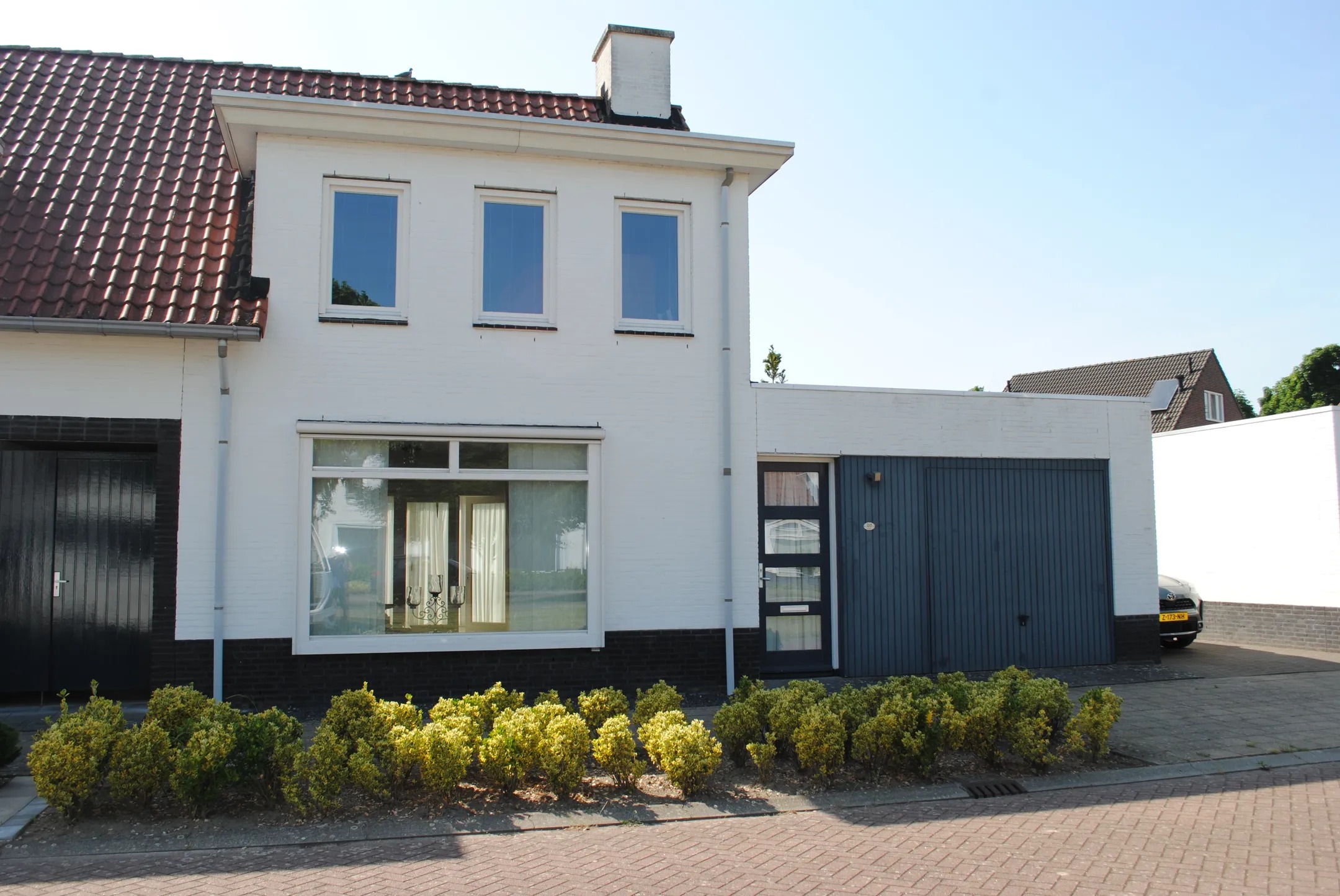 Geschakelde 2-onder-1-kapwoning (hofjeswoning) Beltmolenstraat 26 in Roggel