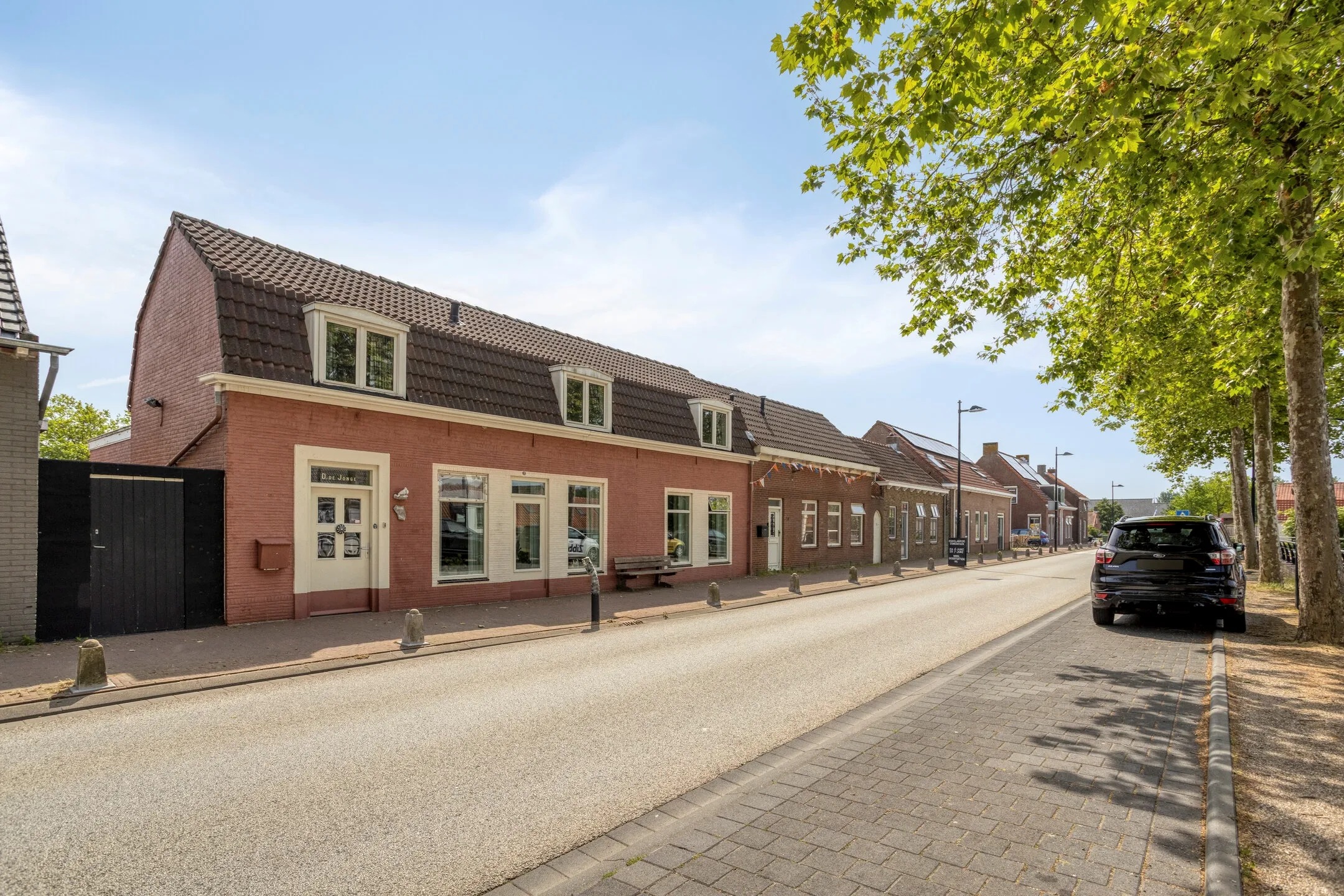 Halfvrijstaande woning (dijkwoning) Kuijpersdijk 12 in 's-Heerenhoek