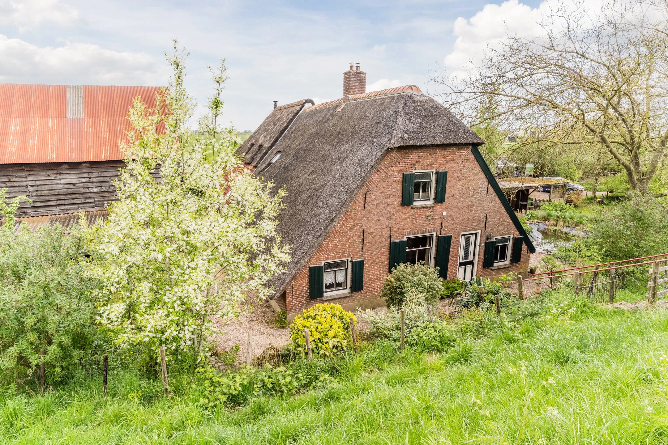 Halfvrijstaande woning (dijkwoning) Rietveld 13 in Arkel