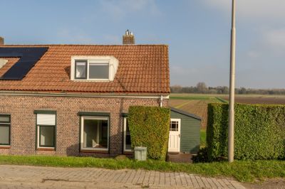 Eengezinswoning, 2-onder-1-kapwoning (dijkwoning) Molendijk 30 in Puttershoek